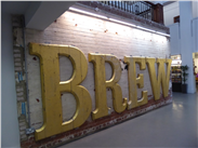 The huge 'Brew' sign inside the restored Tetley tea offices, Leeds.
